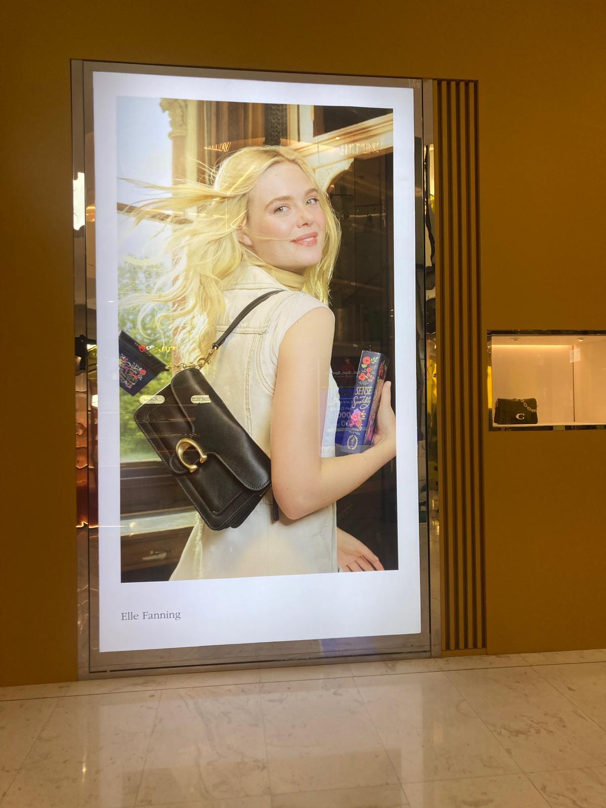A printed storefront lightbox poster
